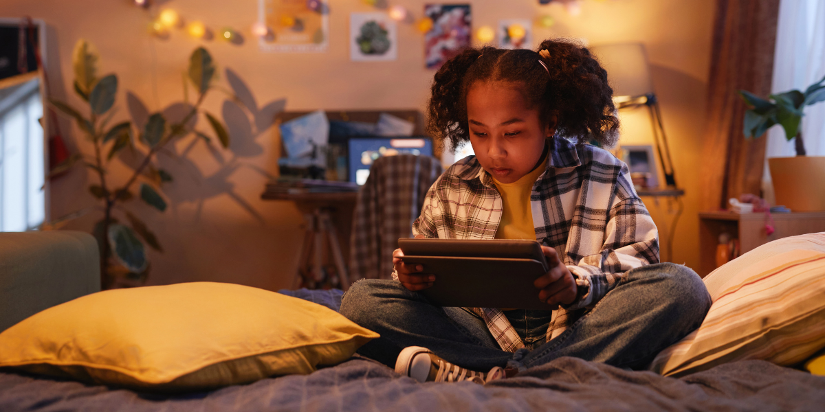 Little girl playing on her IPad