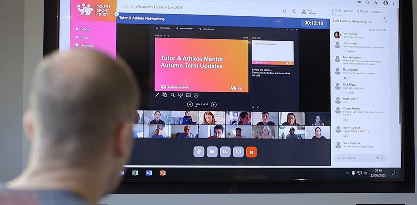 Person viewing a virtual event on a screen