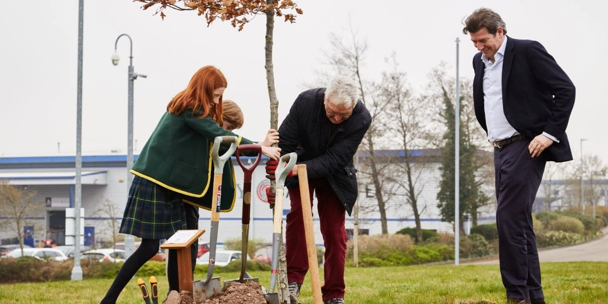 Group of people planting a tree