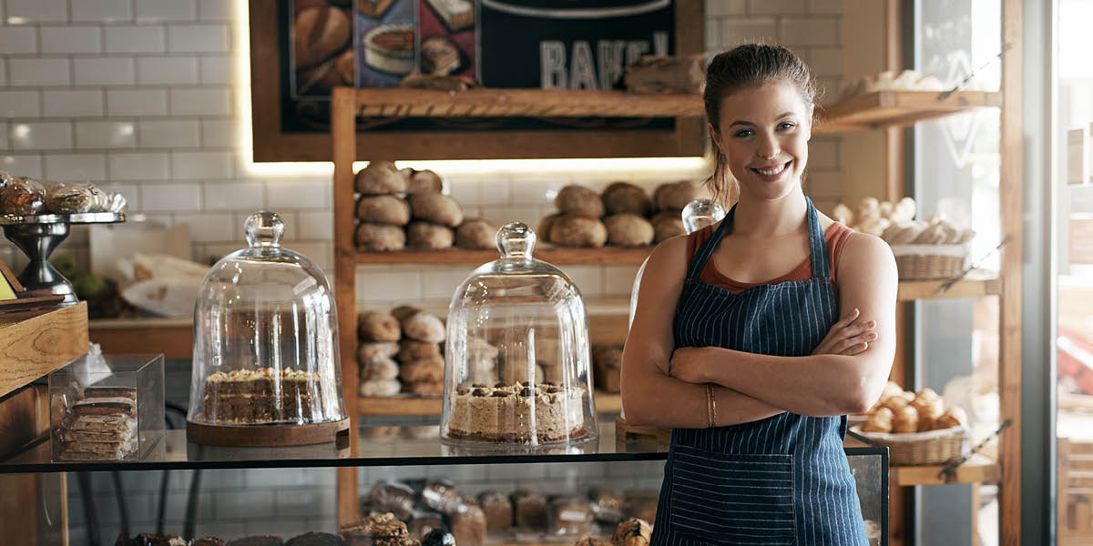 Local business bakery with lady standing in front of counter