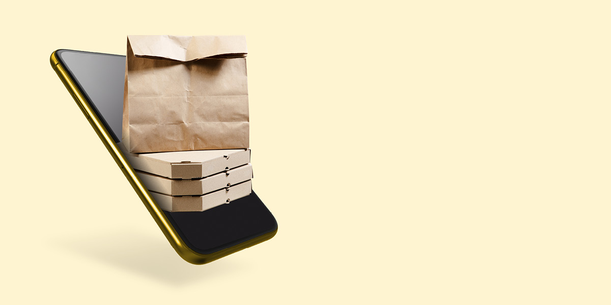 Mobile phone with food packaging with yellow background