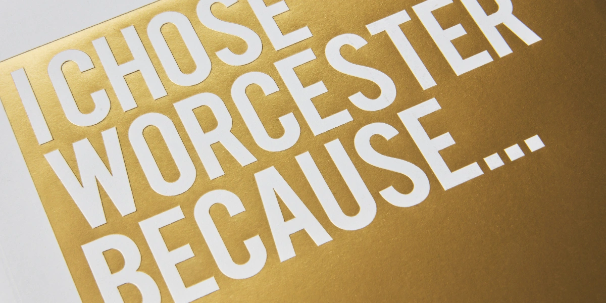 A golden front cover of the University of Worcester's prospectus