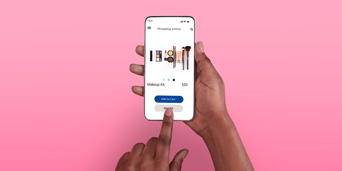 Person purchasing beauty products online through phone with a pink background