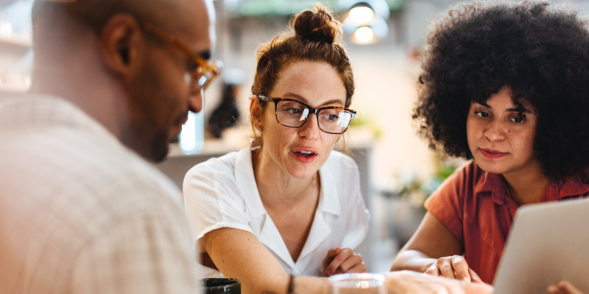Three colleagues planning an event