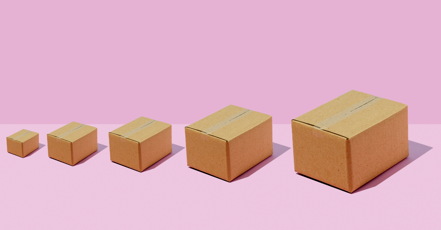 Packages increasing in size on a pink background