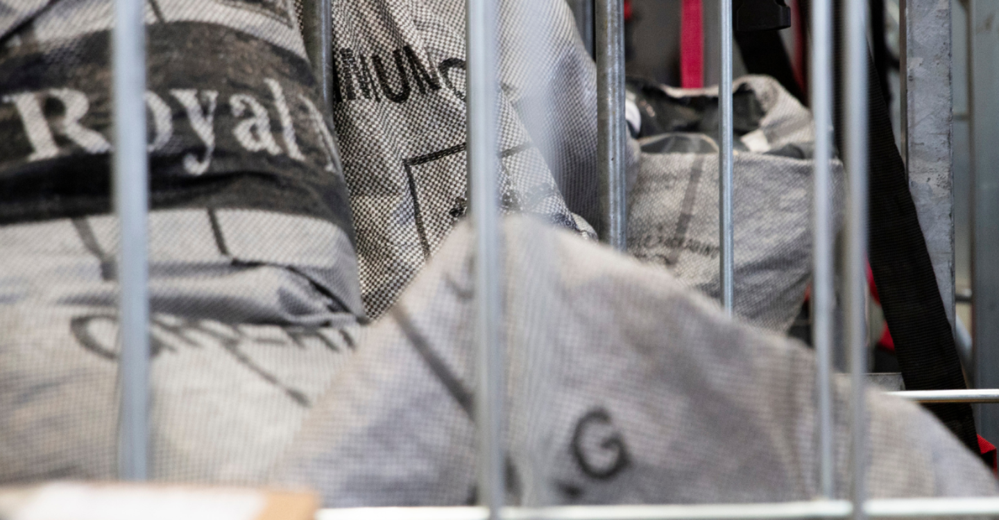 Packages in grey bags in a warehouse