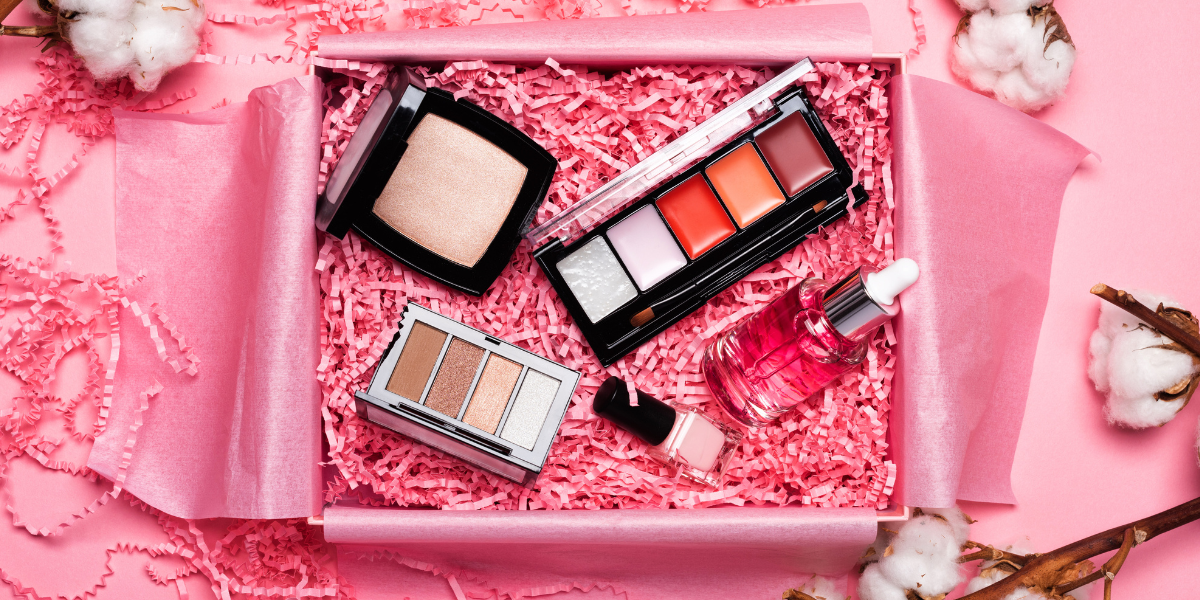 beauty products in a pink influencer box