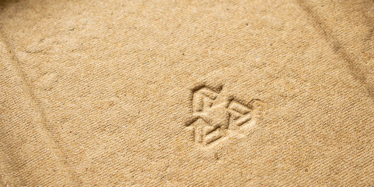 Cardboard packaging with sustainable logo on