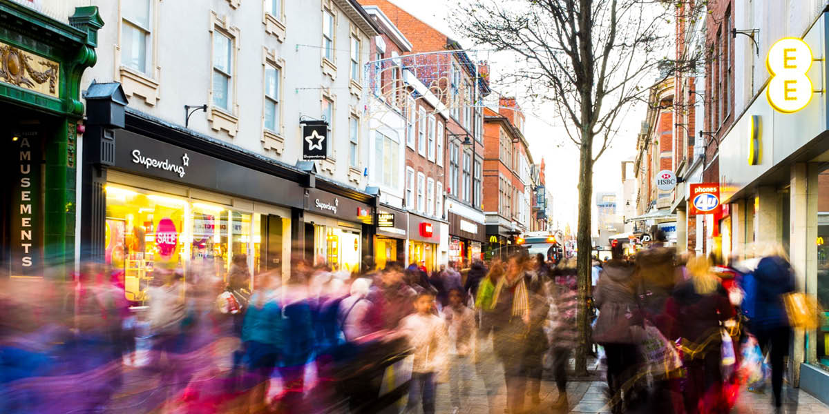 Busy highstreet with blurred people walking